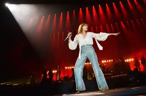 GLASTONBURY, ENGLAND - JUNE 26:  Florence Welch of Florence And The Machine performs live on the Pyramid stage during the first day of the Glastonbury Festival at Worthy Farm, Pilton on June 26, 2015 in Glastonbury, England.  (Photo by Jim Dyson/Getty Images)